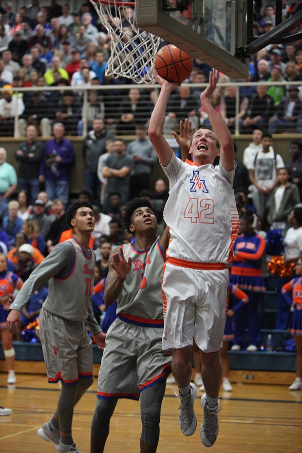 Auburn Mountainview's Tristan Miguel powers his way inside for two against Rainier Beach during state regional action.