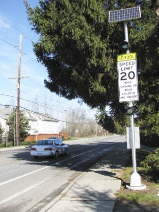 The new school zone flashing lights along 124th Avenue Southeast activate automatically