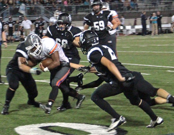 Auburn Mountainview senior Nate Hardin punches one into the heart of the Bonney Lake defense.