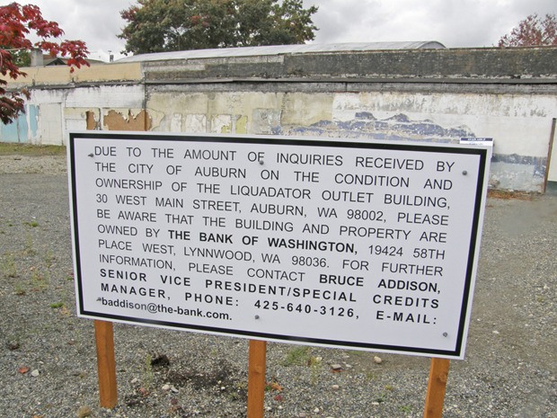 The City has posted a sign explaining who is responsible for the condition and fate of the tattered