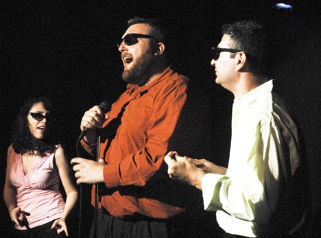 Members of the Chicago City Limits Wikiphobia cast perform a musical number on stage.
