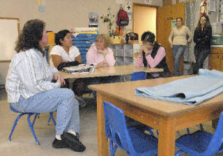 Staff and board members of ACAP discuss the closure and fate of their facility. Seated from the left are: Jackie Kuhns