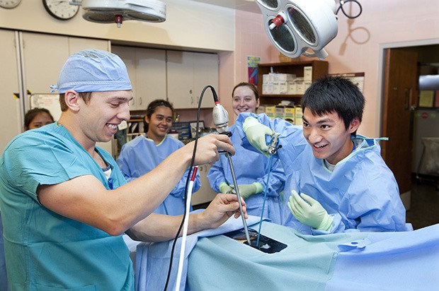 Son Do of Auburn performs a “skittlectomy” during Nurse Camp at Tacoma General Hospital last week. More than 100 students from high schools throughout the South Puget Sound got a close look at careers in nursing at MultiCare Health System’s 12th annual camp. Students practiced skills