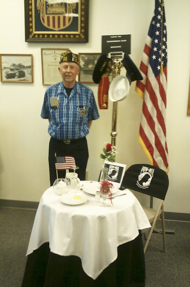 VFW Post 1741 member Bob Newman stands proudly beside The Silent Table at the Post’s Aug. 23 meeting.