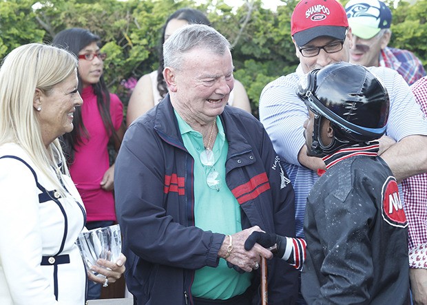 Jerre Paxton and jockey Rocco Bowen in the winner's circle at Emerald Downs on May 11