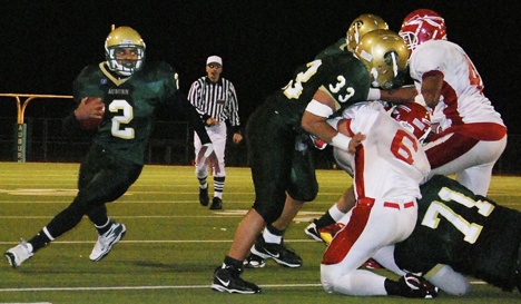 Auburn's Alphonse Wade looks to break open around the corner behind solid blocking. The Trojans prevailed over Marysville-Pilchuck to reach the state 4A quarterfinals.