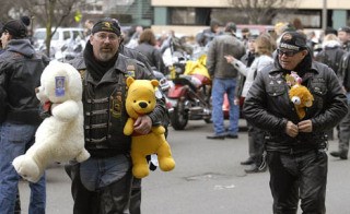 Bob Marshall from Combat Veteran Motorcycle Association brings two stuffed teddy bears to Auburn Regional Medial Center.
