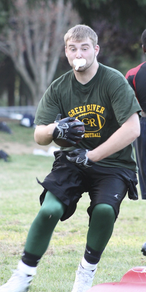 Auburn High School graduate Zac Tate runs through drills at a Green River club football practice.