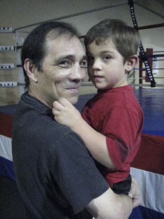 Greg Haugen holds his 5-year-old autistic grandson