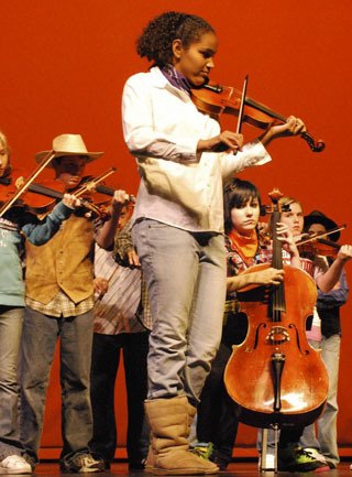 The Cascade Middle School orchestra performs at the recent 10th annual Reaching Out Fair at the Auburn Performing Arts Center. The resource fair's purpose was to educate and support the public in how to keep children and youth safe. The Auburn School District