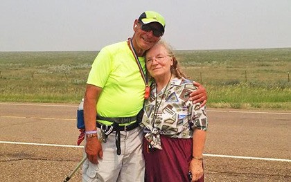 Don and Loretta Stevenson pause to pose along Highway 2 in middle America. Stevenson is on pace in his 3