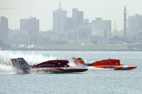 The U-5 Formulaboats.com driven by Jeff Bernard and the U-16 Ellstrom Elam Plus and Dave Villwock go down the front stretch during morning testing at the 2009 Oryx Cup UIM World Championship on Thursday