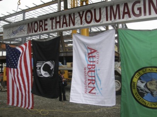 The POW-MIA flag joined others in the raising of the final steel beam to the Auburn Professional Plaza during a recent public ceremony.