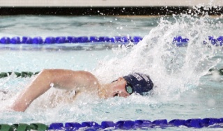Auburn Riverside's Kyle Rogers held on to capture the 100-yard freestyle with a time of 52.40.