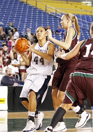 Auburn Riverside sophomore Kat Cooper puts one up in the paint against Eastlake's Alyssa Charlston in round one of the state 4A tourney.