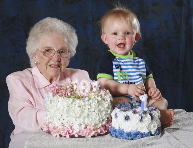 Centenarian Reathel Norberg shares a candid moment with a friend