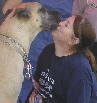 Pauline Oslin  gets a smooch from her Great Dane