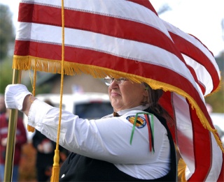 Peggy Caudill performed as a member of the color guard and honor guard during last year's remembrance ceremony at Veterans Memorial Park. Auburn will hold its Veterans Day observance program