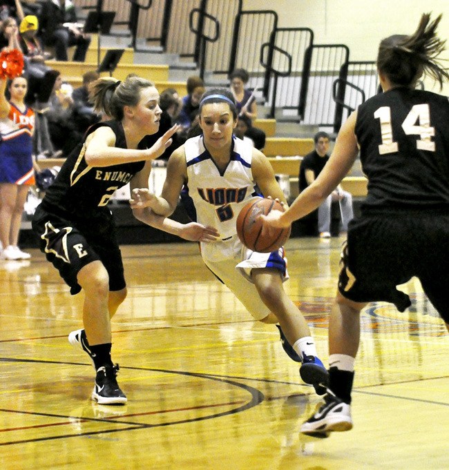 Senior Erika Lombardo splits a pair of Enumclaw defenders on Tuesday.