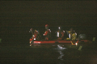 Rescue personnel search for an 18-year-old man who drowned in Lake Wildernes Saturday.