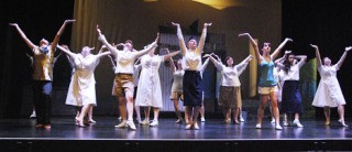 The girls perform an ensemble number in the Auburn High School Actors' Guild production of 'South Pacific'.