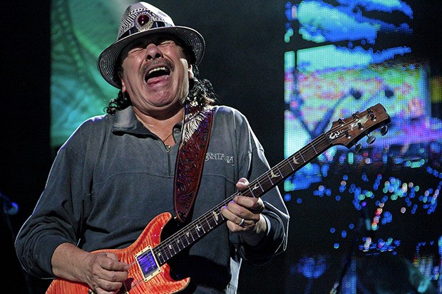 The legendary Carlos Santana above does what he does best on the guitar – makes it sing. Santana and his band brought their blend of rock