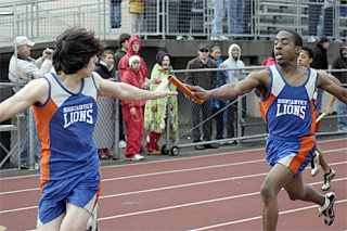 Freshman Jarey Suiter hands the baton to senior Josh Towne