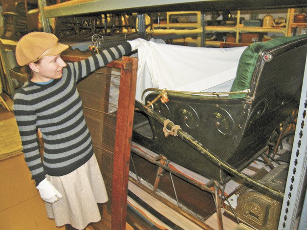 Collection Curator Hilary Pittenger ponders what to do with this horse-drawn sleigh