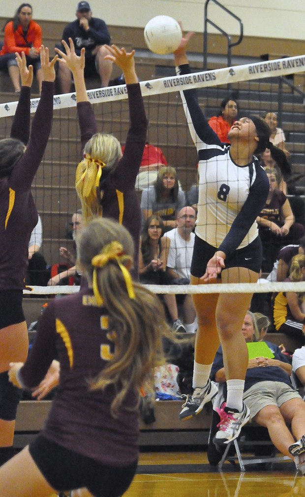 Auburn Riverside's Precious Atafua spikes the ball in a match against Enumclaw on Tuesday.
