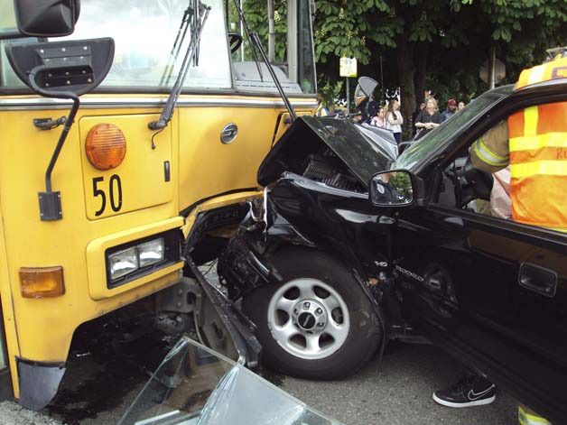 An SUV-bus collision on 37th Street Southeast sent the vehicle's driver and a student on the bus to the hospital.