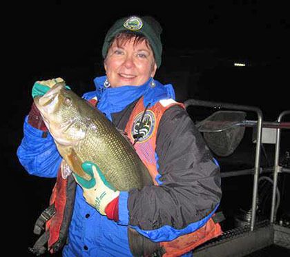 Sen. Pam Roach with a bass taken from Lake Tapps during a state fish study she arranged in 2013.