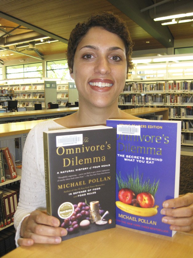 Librarian Jennifer Fairchild displays Michael Pollan’s books