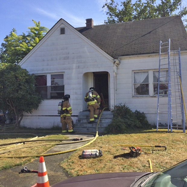 VRFA firefighters respond and douse a house fire in the 100 block of 15th Street Southeast on Friday afternoon.