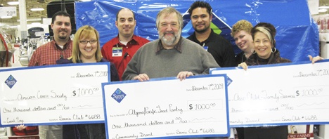 Sam's Club reps joined area charities to present donations.