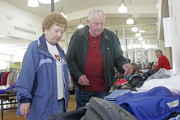 John and Dolores Alexander browse through the overnight bags section during the recent Auburn Senior Activities Center Rummage Sale.