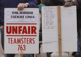 Union workers picketed outside Oak Harbor Freight Lines headquarters for five months. The streets were quiet Friday as the Auburn-based freight company and the union agreed to end the strike.