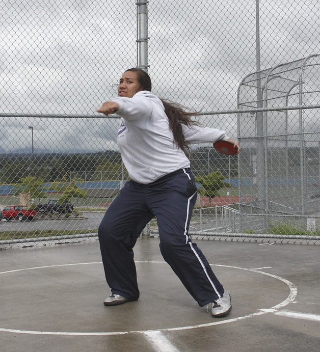 Marissa Paopao winds up with the discus from the circle at Auburn Mountainview High School.