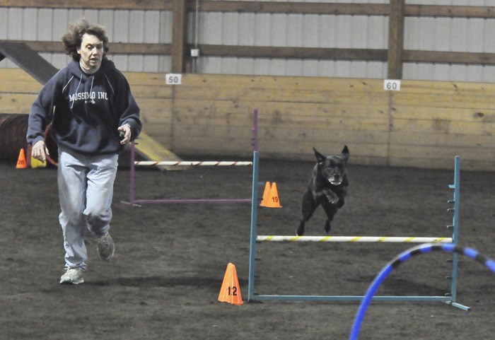 Kathy Duarte-Wilson escorts her Lab mix