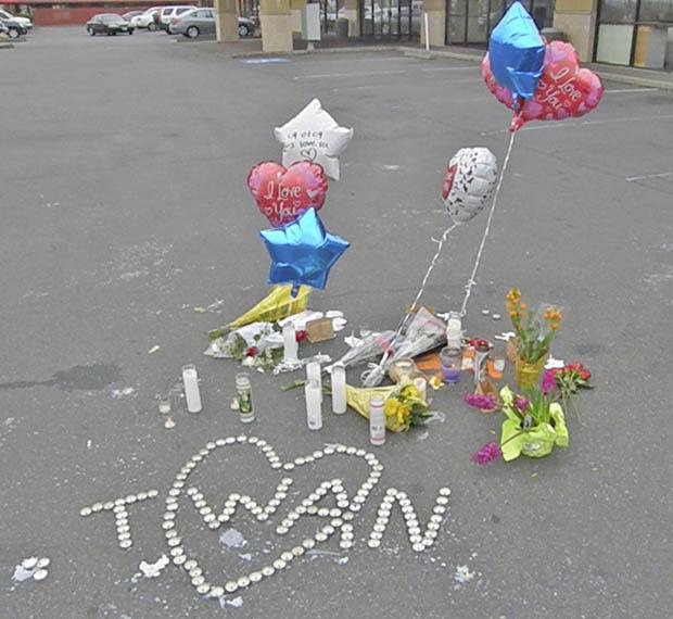 Mourners leave a memorial for Antuan Greer