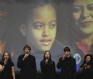 The Green River Community College Rendezvous Choir performs at the Barack Obama inauguration party at the school.
