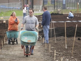 Dozens showed up last Saturday morning as Auburn Community Garden opened at its new site at 1030 8th St. NE