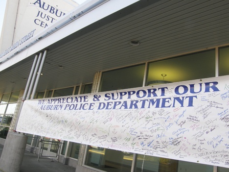 A banner in support of the Auburn police force graces the front of the Auburn Justice Center this week. The banner