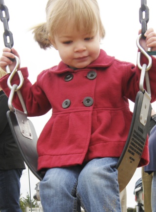 Bridget Both occupies a swing at Bothell Park. The new park