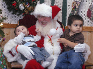 Bob Johnson enjoys his role as jolly Santa Claus for area children who visit the Optimist Club-supported Santa House in downtown Auburn. Justin Martinez