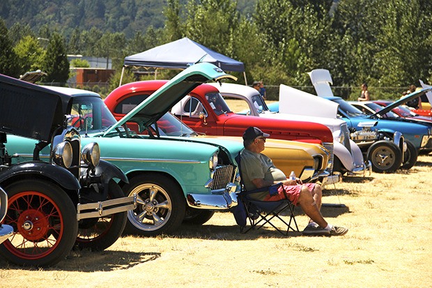 Steve Hamilton takes a break from the sun in the shade of his 1955 Chevrolet Bel Air hard top. Hamilton’s car was one of the classics on display at this past weekend’s Auburn Valley Y Car Show and Touch a Truck event.