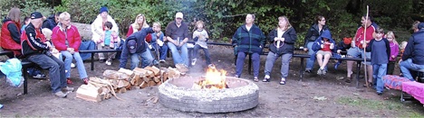 A group gathers around the campfire during last weekend’s S’more Than You Imagined event at Game Farm Wilderness Park. The annual event