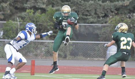 Auburn's Clayton Brown intercepts a pass during the Trojans' rout of Federal Way.