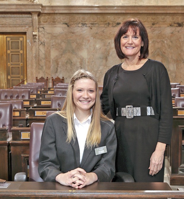 Student page Emily Hill pictured with Rep. Cathy Dahlquist on the House floor in Olympia