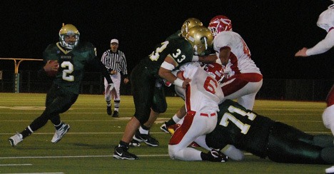 Junior Alphonse Wade scampers for some yardage against Marysville-Pilchuck at Troy Field. Wade