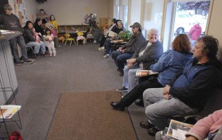 The waiting area is full as the demand continues to grow for those in need at the Auburn Food Bank.